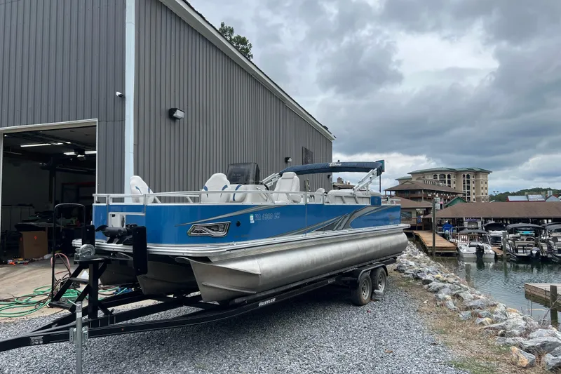 The Image of 2021 Tahoe Pontoon GT Center Console Fish 25' on trailer near marina. - 0