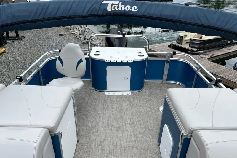 Slide: The Image of 2021 Tahoe Pontoon GT Center Console Fish 25' with seating and fishing setup. - 13