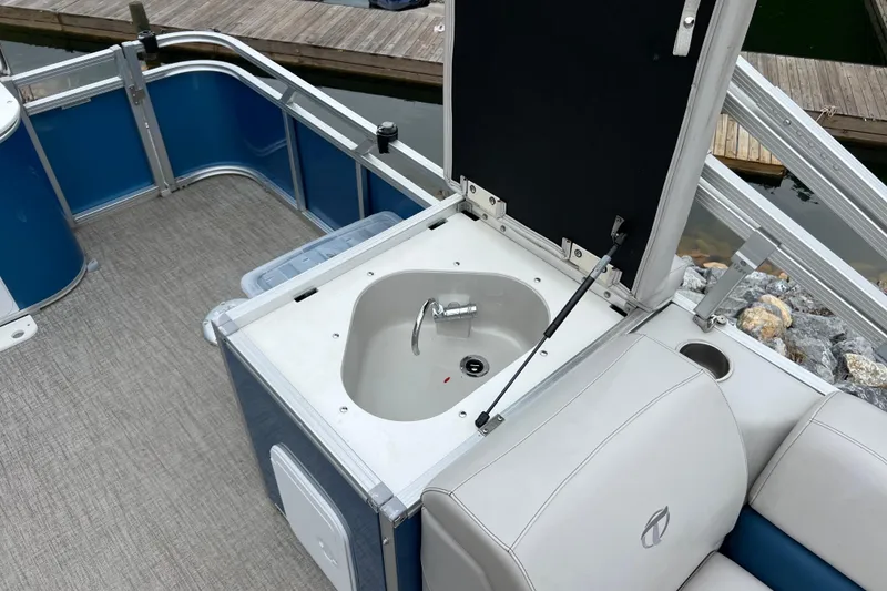 Slide: The Image of 2021 Tahoe Pontoon GT Center Console Fish 25' with onboard sink and seating. - 14