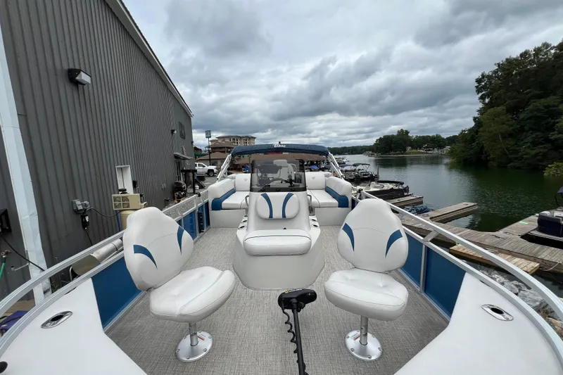 Slide: The Image of 2021 Tahoe Pontoon GT Center Console Fish 25' on a scenic lake dock. - 6