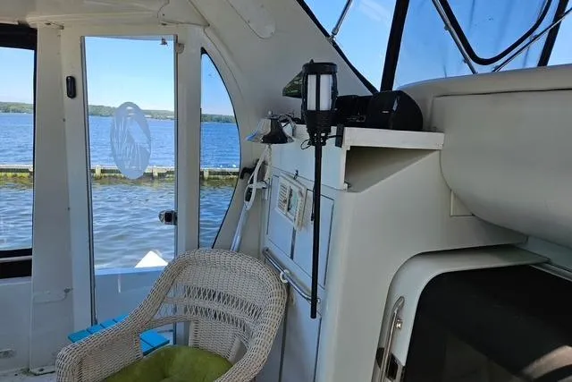 Slide: The Image of Interior of 2003 Carver 444 Cockpit Motor Yacht with seating and plants. - 11