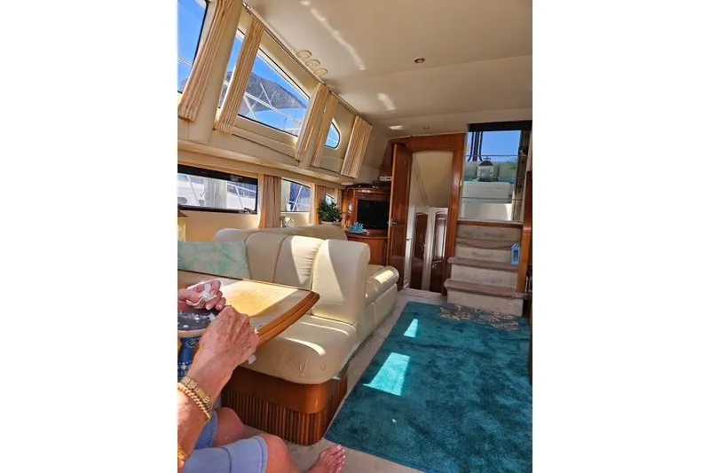 Slide: The Image of Etched heron silhouette against vibrant sunset over water, Carver 444 Cockpit Motor Yacht, 2003. - 19