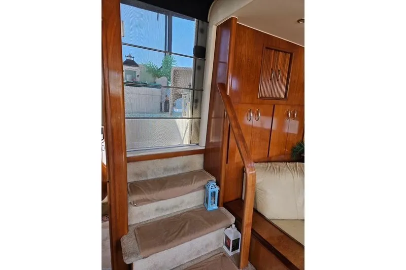 Slide: The Image of Luxurious interior of 2003 Carver 444 Cockpit Motor Yacht with elegant seating and decor. - 22