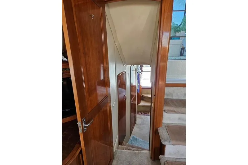 Slide: The Image of Luxurious interior of 2003 Carver 444 Cockpit Motor Yacht with elegant seating and decor. - 23