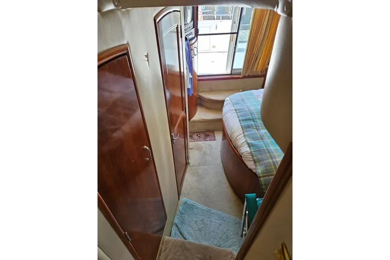 Slide: The Image of Luxurious interior of 2003 Carver 444 Cockpit Motor Yacht with plush seating and elegant decor. - 26