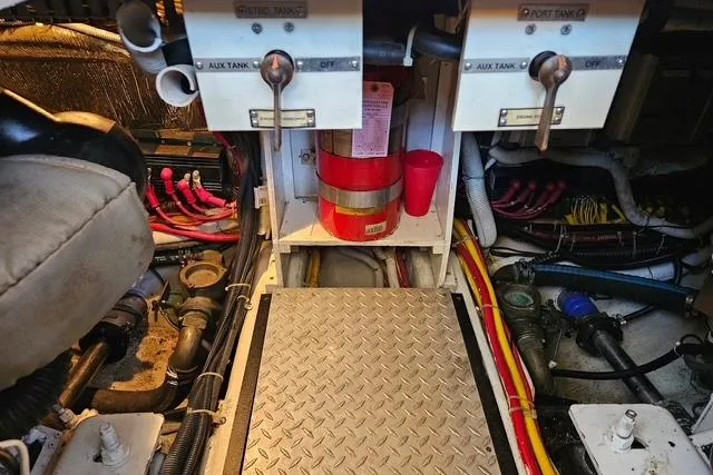 Slide: The Image of Engine room of 2003 Carver 444 Cockpit Motor Yacht with fuel tanks and wiring. - 40