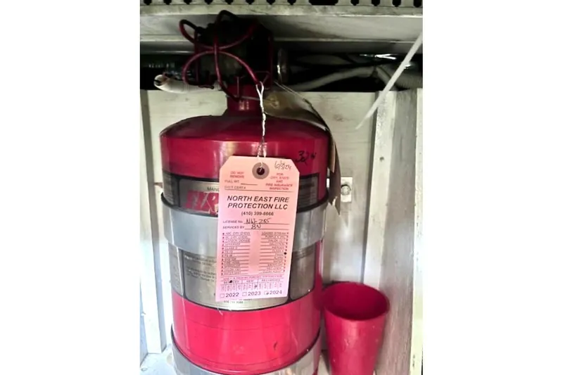 Slide: The Image of Fire extinguisher on 2003 Carver 444 Cockpit Motor Yacht, tagged by North East Fire Protection. - 41