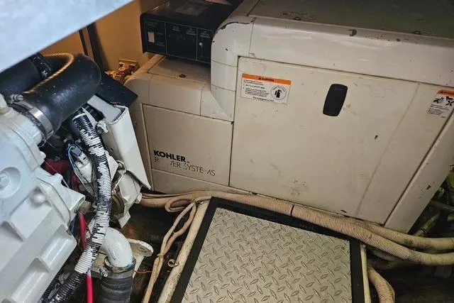 Slide: The Image of Engine room of 2003 Carver 444 Cockpit Motor Yacht with Kohler generator. - 42