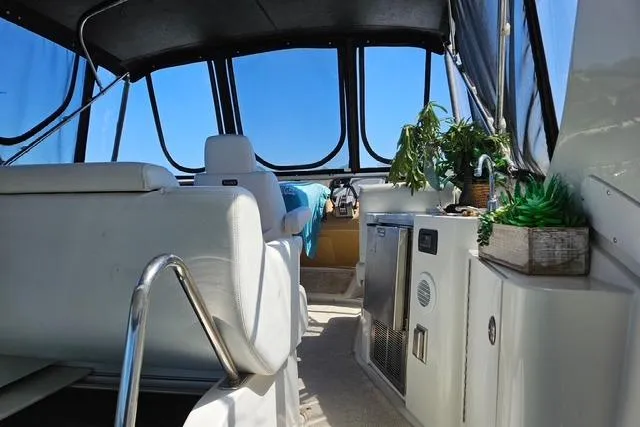 Slide: The Image of 2003 Carver 444 Cockpit Motor Yacht dashboard with Raymarine navigation system. - 8