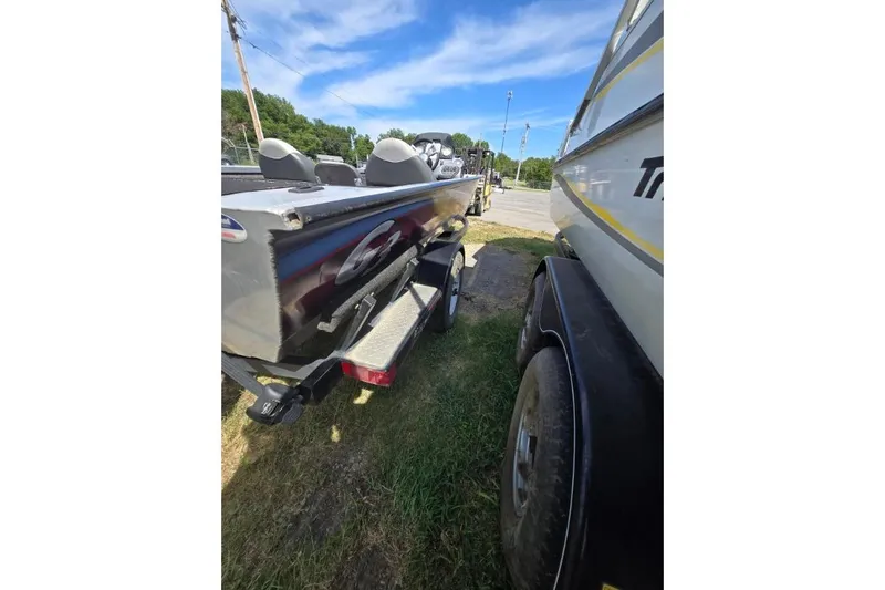 Slide: The Image of 2014 G3 Eagle Talon 19 DLX boat on trailer, parked outdoors under blue sky. - 11
