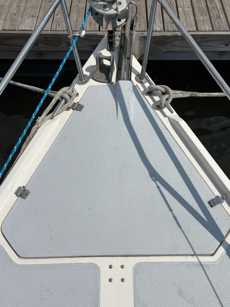 Slide: The Image of Bow of a 1992 Catalina 34 sailboat docked, featuring deck and rigging. - 10