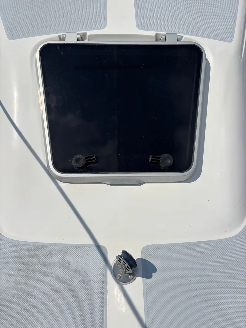 Slide: The Image of Hatch on a 1992 Catalina 34 sailboat deck, featuring a sleek design. - 17