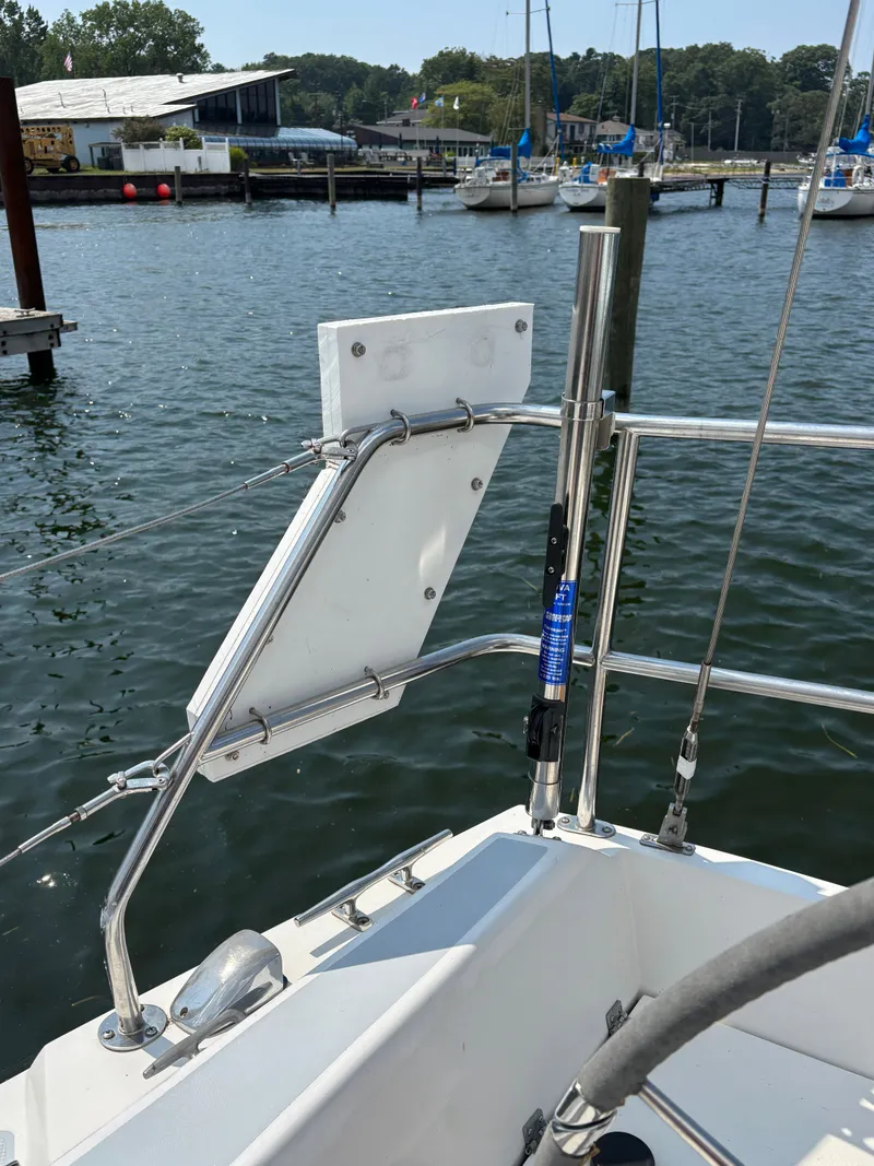 Slide: The Image of Sailboat deck view, Catalina 34, 1992 model, docked at marina with scenic background. - 21