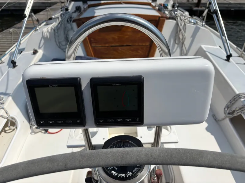 Slide: The Image of Cockpit of 1992 Catalina 34 sailboat with Garmin navigation displays and compass. - 25