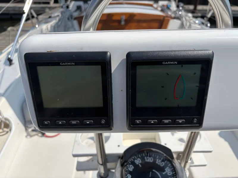 Slide: The Image of Garmin navigation displays on a 1992 Catalina 34 sailboat dashboard. - 26