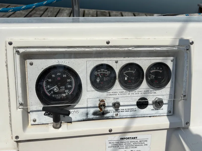Slide: The Image of Control panel of a 1992 Catalina 34 yacht with gauges and switches. - 28