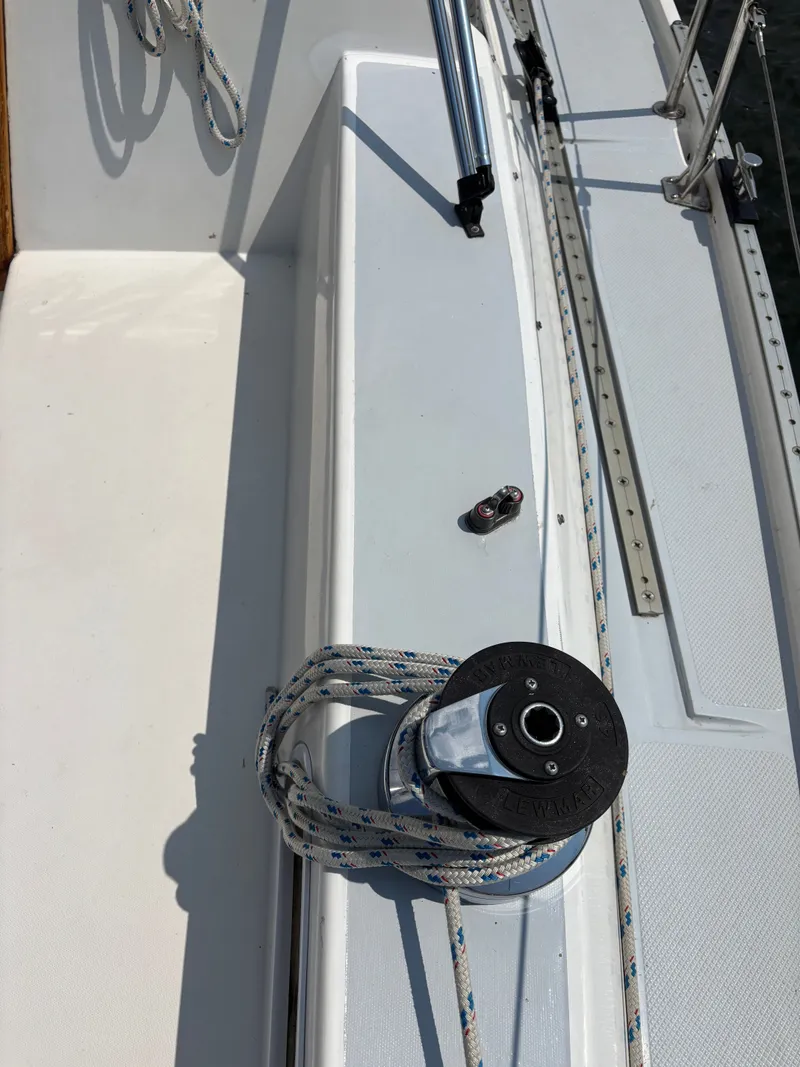 Slide: The Image of Deck of 1992 Catalina 34 sailboat with winch and ropes. - 33