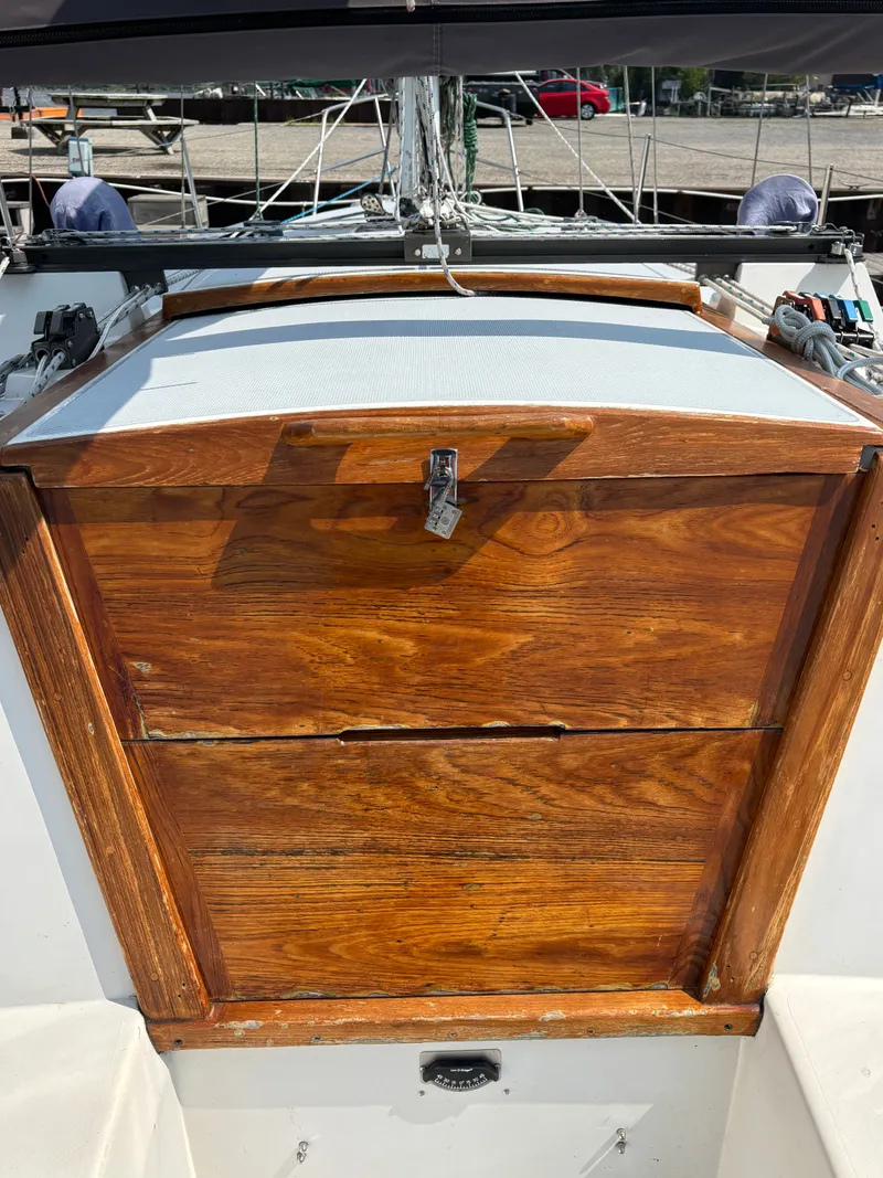Slide: The Image of Wooden hatch of a 1992 Catalina 34 sailboat, docked with visible rigging. - 41