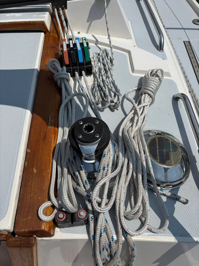Slide: The Image of Deck of 1992 Catalina 34 sailboat with ropes and winch system. - 42