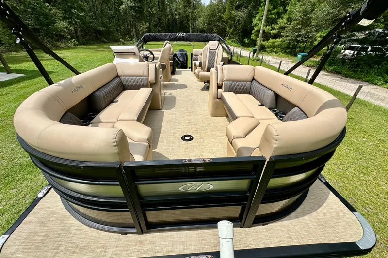 Slide: The Image of 2022 Harris FloteBote 230 Super Sunliner LX pontoon boat with luxurious seating and spacious layout. - 12