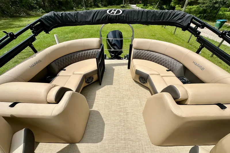Slide: The Image of 2022 Harris FloteBote 230 Super Sunliner LX interior with beige seating and black canopy. - 15