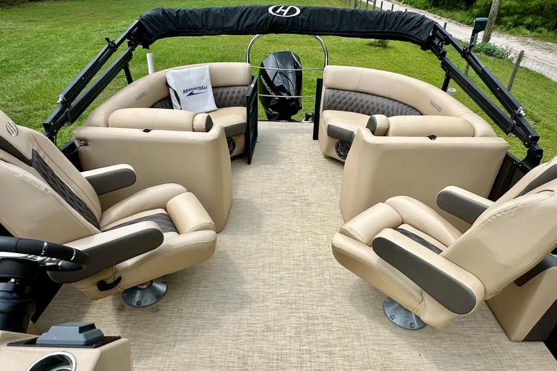 Slide: The Image of 2022 Harris FloteBote 230 Super Sunliner LX with luxurious seating and sleek design. - 24