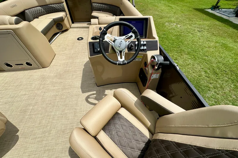 Slide: The Image of 2022 Harris FloteBote 230 Super Sunliner LX interior with luxurious seating and modern dashboard. - 25
