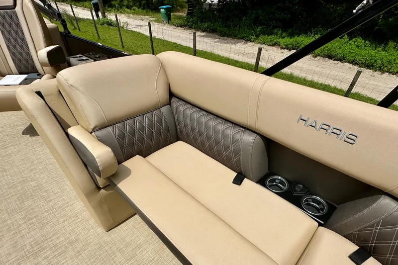 Slide: The Image of 2022 Harris FloteBote 230 Super Sunliner LX with beige seating and cup holders. - 30