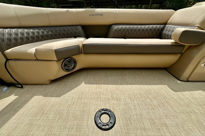 Slide: The Image of 2022 Harris FloteBote 230 Super Sunliner LX interior with beige seating and speaker. - 31