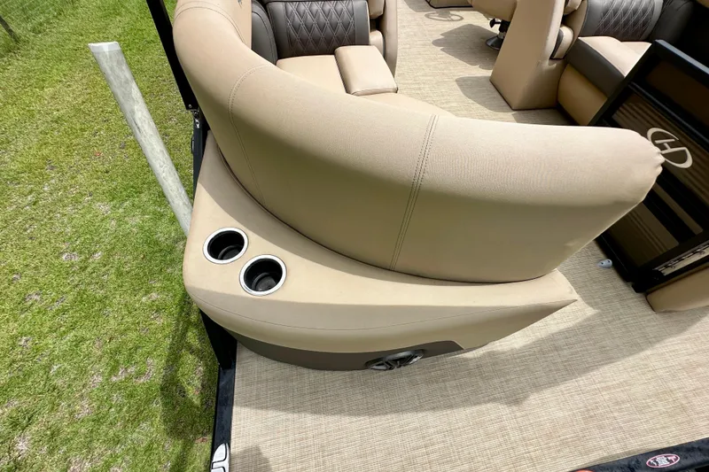 Slide: The Image of 2022 Harris FloteBote 230 Super Sunliner LX interior with beige seating and cup holders. - 33