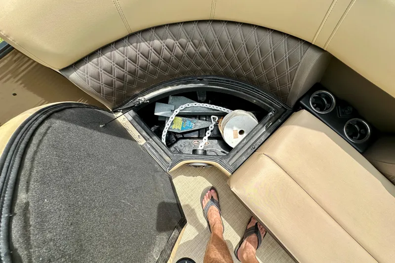 Slide: The Image of Open storage compartment in 2022 Harris FloteBote 230 Super Sunliner LX boat interior. - 36
