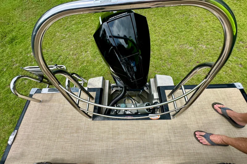 Slide: The Image of 2022 Harris FloteBote 230 Super Sunliner LX boat engine and deck, viewed from above. - 41