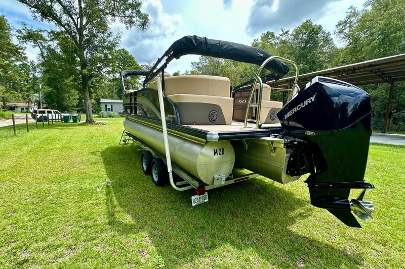Slide: The Image of 2022 Harris FloteBote 230 Super Sunliner LX pontoon boat on grassy lawn. - 6