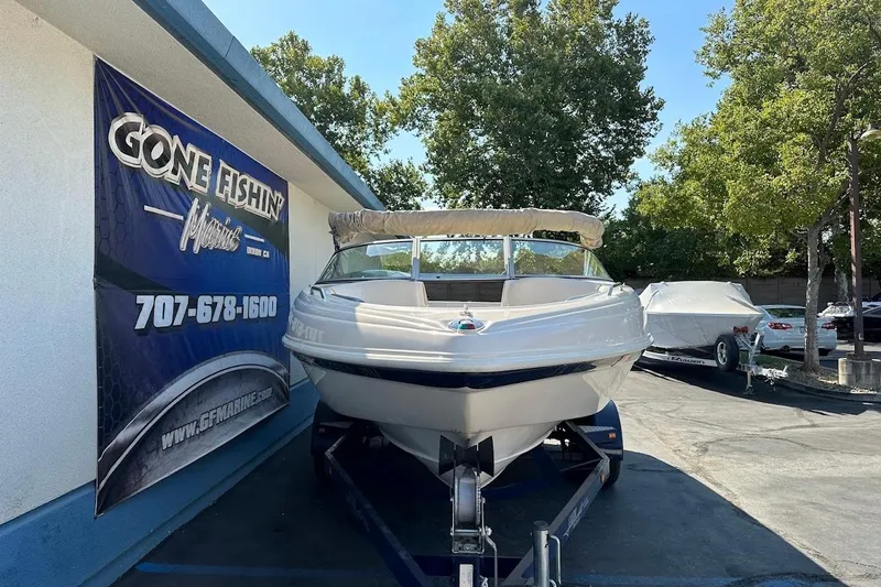 Slide: The Image of 2002 Rinker 212 Captiva boat on trailer at Gone Fishin' Marine dealership. - 3