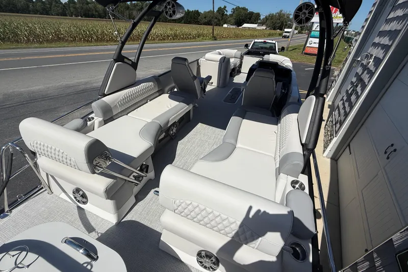 Slide: The Image of Luxurious 2026 Avalon 2585 Excalibur LTD pontoon boat with plush seating and modern design. - 12