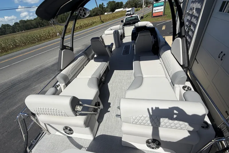 Slide: The Image of Luxurious 2026 Avalon 2585 Excalibur LTD pontoon boat with plush seating and high-performance features. - 13