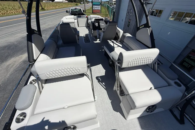 Slide: The Image of 2026 Avalon 2585 Excalibur LTD boat interior with luxurious seating and high-performance features. - 14