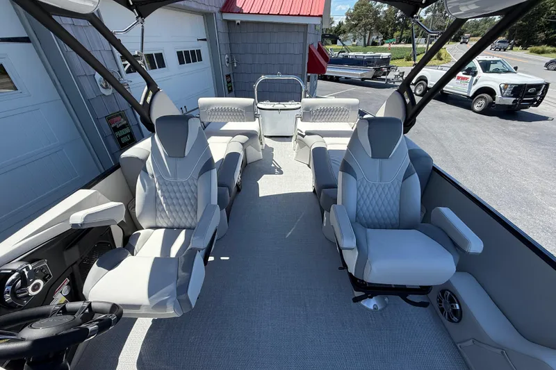 Slide: The Image of Luxurious interior of 2026 Avalon 2585 Excalibur LTD pontoon boat with plush seating. - 18