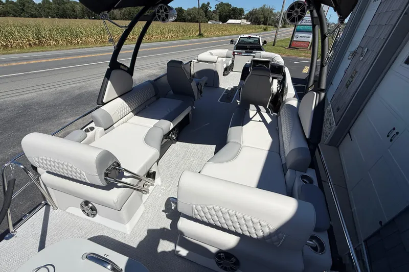 Slide: The Image of 2026 Avalon 2585 Excalibur LTD boat interior with luxurious seating and high-performance features. - 26