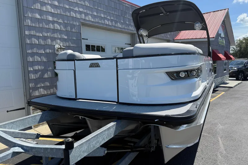 Slide: The Image of 2026 Avalon 2585 Excalibur LTD boat on trailer, featuring sleek design and high-performance Mercury engine. - 4