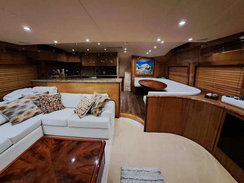 Slide: The Image of Luxurious interior of 2006 Hatteras 68 Convertible yacht with plush seating and elegant decor. - 10
