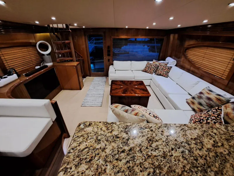 Slide: The Image of Luxurious interior of 2006 Hatteras 68 Convertible yacht with elegant wood finishes. - 12