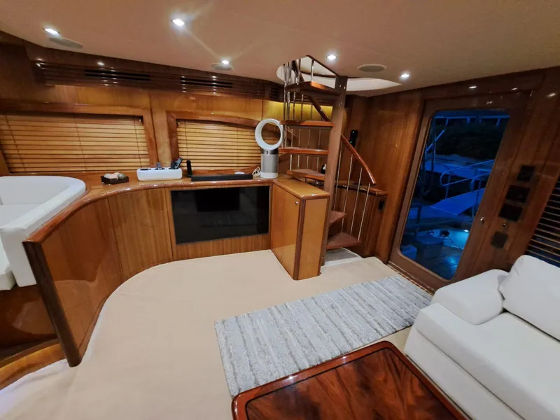 Slide: The Image of Luxurious interior of 2006 Hatteras 68 Convertible yacht with modern kitchen and cozy seating area. - 14