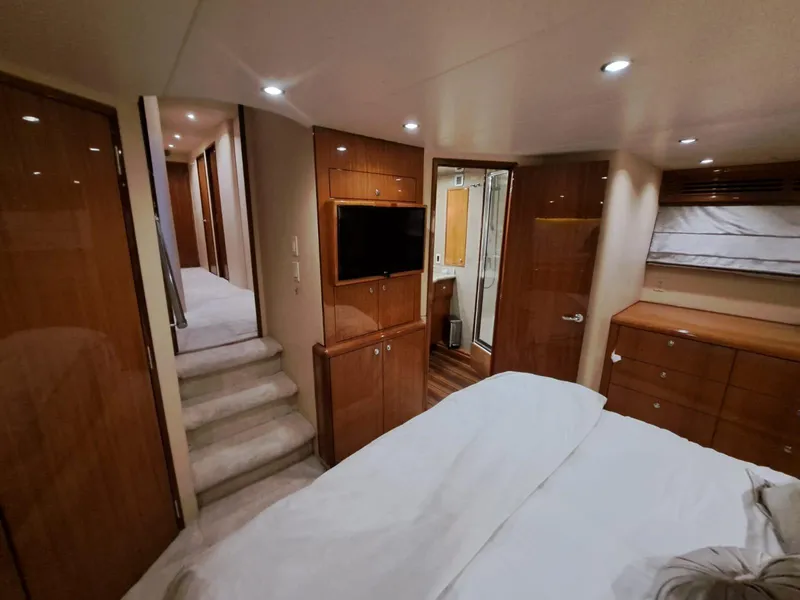 Slide: The Image of Luxurious bathroom in 2006 Hatteras 68 Convertible yacht with granite countertop and glass shower. - 26