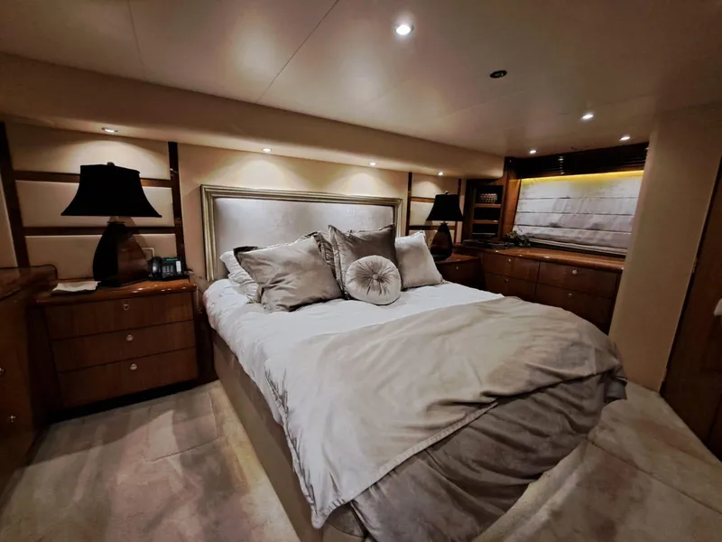 Slide: The Image of Luxurious bedroom interior of 2006 Hatteras 68 Convertible yacht with modern amenities. - 28