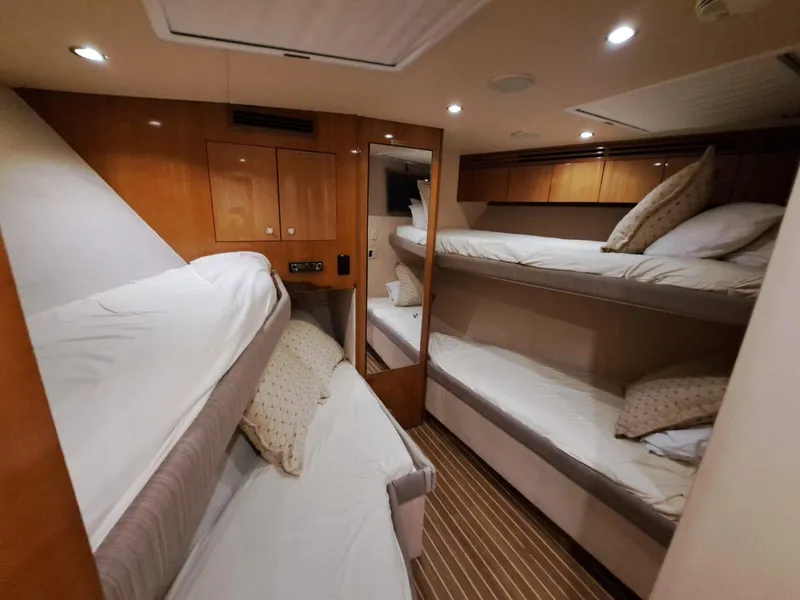 Slide: The Image of Interior hallway of 2006 Hatteras 68 Convertible yacht with wooden doors and carpeted floor. - 31