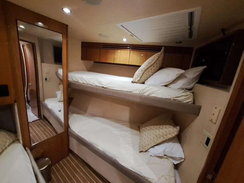 Slide: The Image of Luxurious bathroom in 2006 Hatteras 68 Convertible yacht with shower, sink, and toilet. - 33