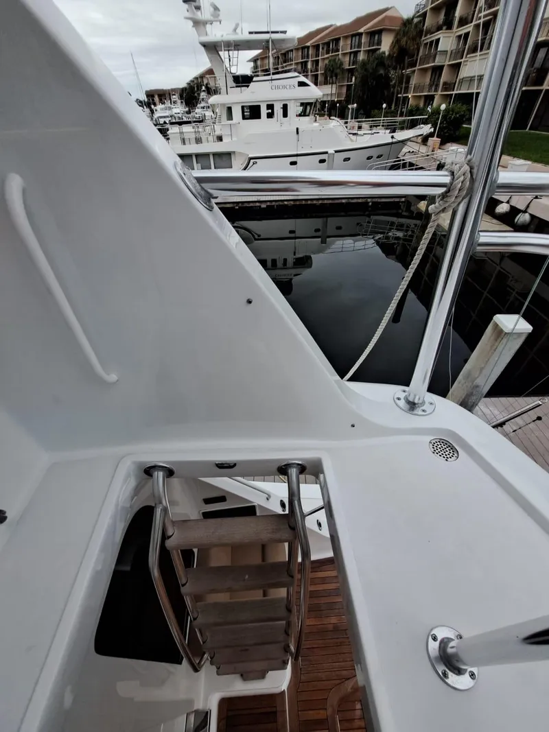 Slide: The Image of Steering console of 2006 Hatteras 68 Convertible yacht with modern controls. - 44