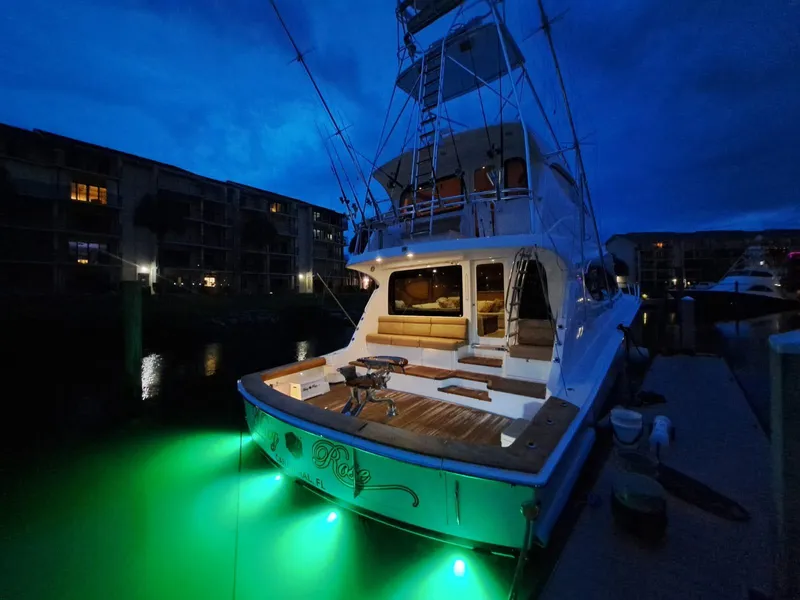 Slide: The Image of 2006 Hatteras 68 Convertible yacht deck with seating and fishing table. - 6