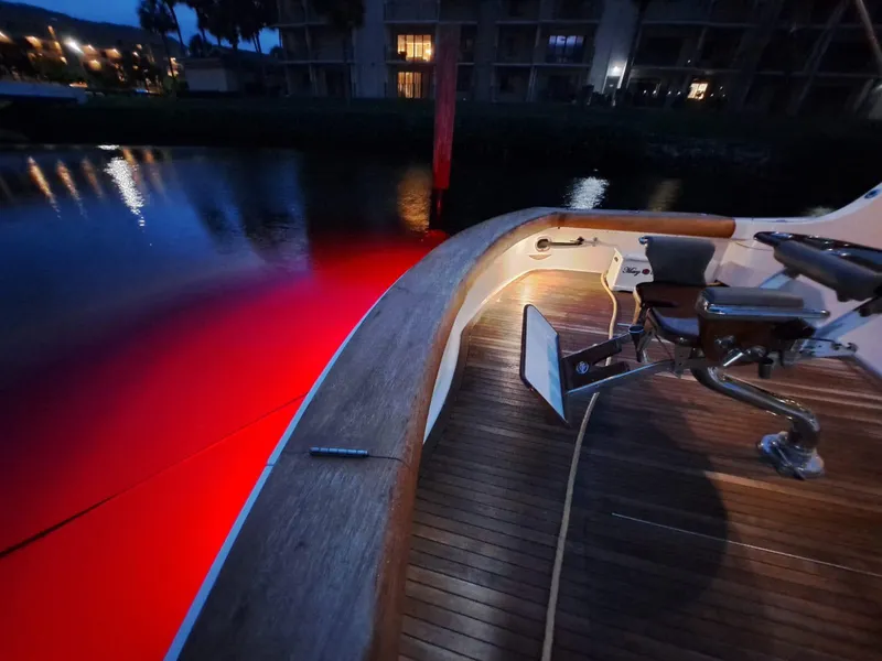 Slide: The Image of Luxurious 2006 Hatteras 68 Convertible yacht deck with seating and fishing chair. - 8